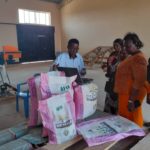 Dr Kihwele demonstrates how he teaches his customers about the benefits of fortification and brings fortified flour to local families