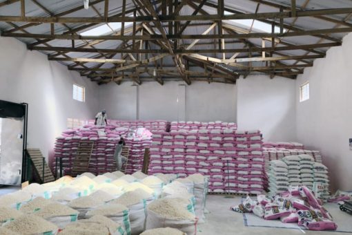 a warehouse room full of Sanku flour bags