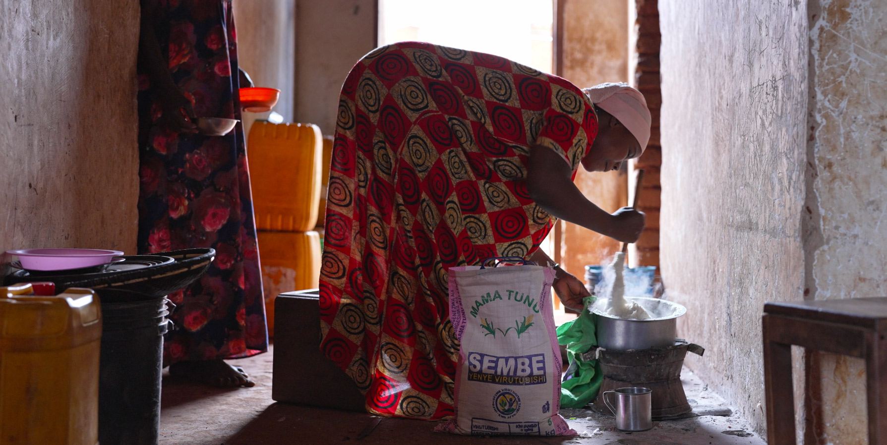 woman stirring bag of flour in Hidden Hunger short film